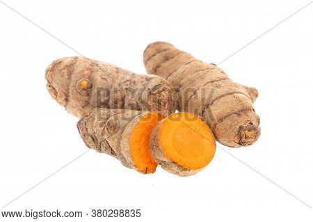 Turmeric Powder And Turmeric Isolated On White Background.
