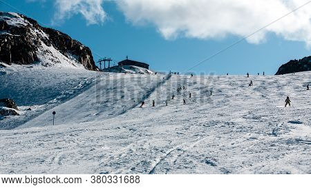 Stubai, Austria - November 2, 2011: Snowboarders And Skiers Riding On The Slopes Of The Stubaier Gle