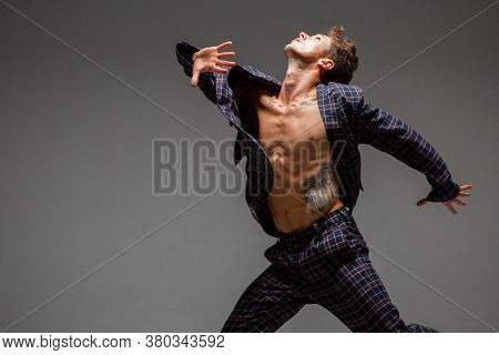 Cool Young Guy Dancer In Suit Dancing Modern Expressive Dance In Studio. Dance School Poster. Dance 