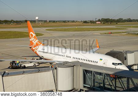 Lviv, Ukraine - 09 Aug 2020: Sky Up Charter Plane Unloads Baggage At The Lviv Lwo Danylo Halytski Na