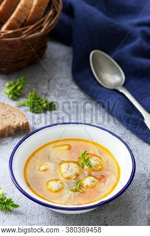 Dietary Soup With Meatballs, Potatoes And Noodles Served With Rye Bread With Bran. Childrens Menu.