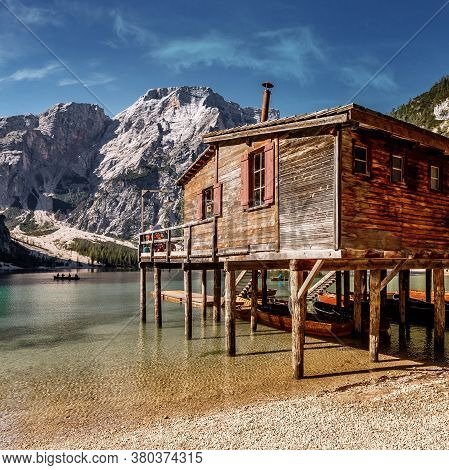 Incredible View On Majestic Famouse Lake Braies During Sunrise. Wonderful Sunny Landscape In Dolomit