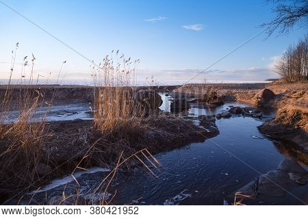 Spring Sunset Over The Melting Ice Of The Gulf Of Bothnia