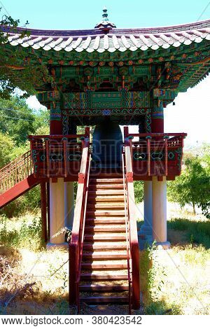 August 15, 2020 In Banning, Ca:  Steps Leading Up To A Deck With A Gong Bell Taken At The Diamond Ze