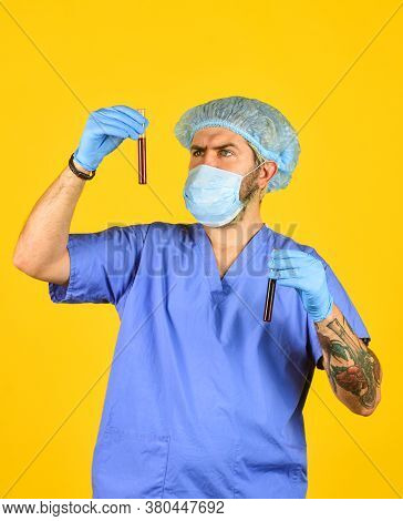 Nurse Man Wear Respirator Mask Hold Blood Test. Symptoms Of Acute Respiratory Infection. New Virus S
