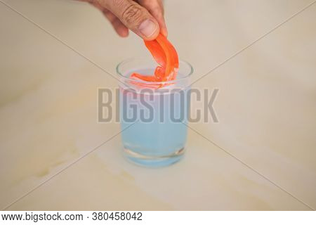 Dental Mouthpiece Cleaning Tablet In A Glass