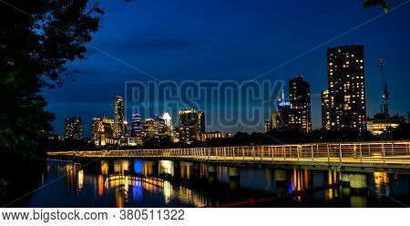 Austin Texas Nightscape Views Of The City Glowing Lights At Blue Hour After Dark With The Pedestrian