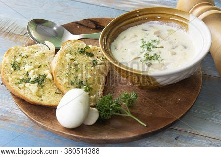 Garlic Bread And Cream Mushroom Soup On The Woodplate