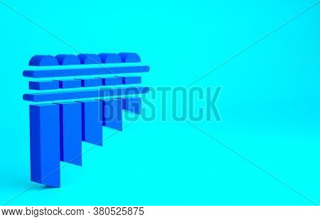 Blue Pan Flute Icon Isolated On Blue Background. Traditional Peruvian Musical Instrument. Zampona. F
