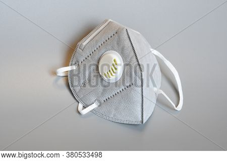Kn95 Or N95 Mask With Valve For Protection Pm 2.5 And Corona Virus On Grey Background. Prevention Of