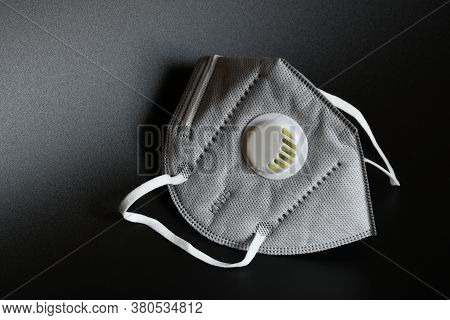Kn95 Or N95 Mask With Valve For Protection Pm 2.5 And Corona Virus On Black Background. Prevention O