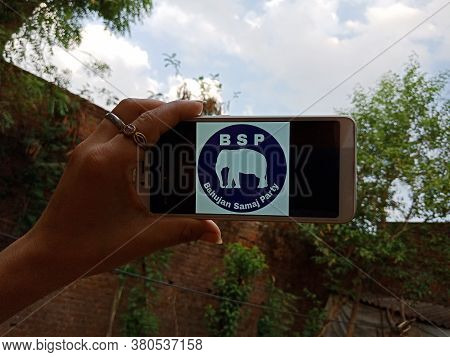 District Katni, India - 28 May 2020: An Indian Lady Holding Smart Phone With Displaying Bahujan Sama
