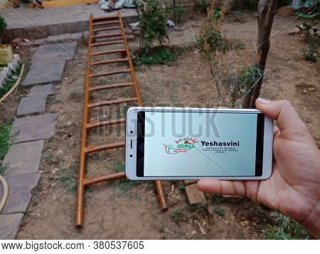 District Katni, India - 28 May 2020: An Indian Lady Holding Smart Phone With Displaying Yeshasvini C