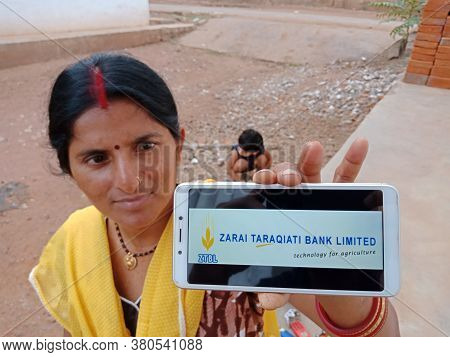 District Katni, India - June 02, 2020: An Indian Woman Holding Smart Phone With Displaying Zarai Tar