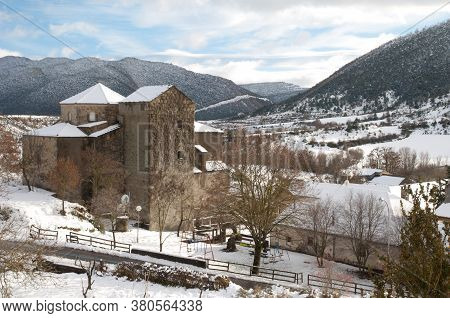 Church and rural landscape covered with snow. Sabinanigo Alto. Huesca. Aragon. Spain.