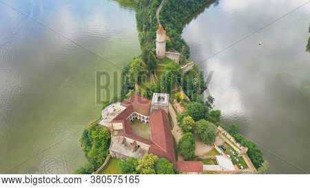 Aerial View On Czech Medieval Castle Zvikov, Situated On Rocky Outcrop Above The Confluence Of Two R