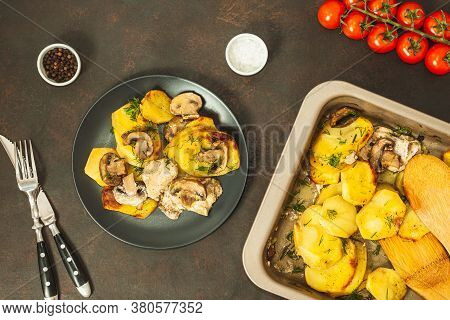 Potato Wedges Baked With Mushrooms, Herb Oven Roasted, With Thyme, A Close-up In A Baking Tray. Top 