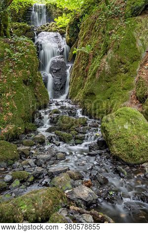 Long Exposure Of The Clampitt Falls Waterfall At Canonteign Falls In Devon
