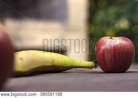 Apple And Banana Over A Wood Table With Copy Space , Healthy Snack