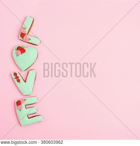 Inscription Love By Homemade Cookies With Green Icing On Pink Pastel Color. Love Romance Concept. Va