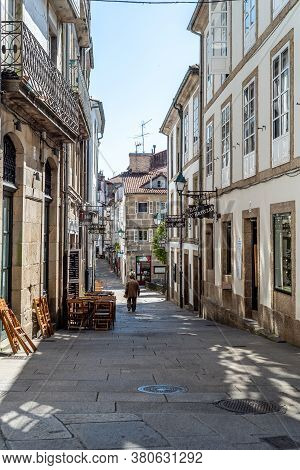 Santiago De Compostela, Spain - July 18, 2020: Old Street With Restaurants In Medieval Town