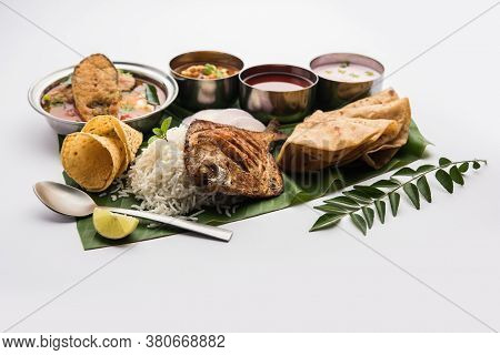 Indian Fish Platter Or Seafood Thali Served In A Steel Plate Or Over Banana Leaf