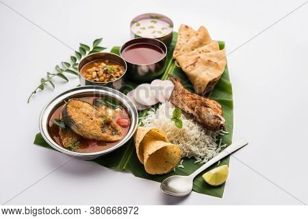 Indian Fish Platter Or Seafood Thali Served In A Steel Plate Or Over Banana Leaf