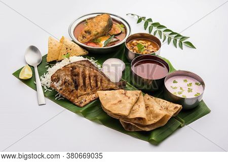 Indian Fish Platter Or Seafood Thali Served In A Steel Plate Or Over Banana Leaf