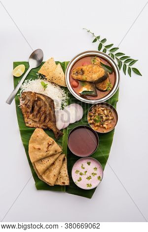 Indian Fish Platter Or Seafood Thali Served In A Steel Plate Or Over Banana Leaf