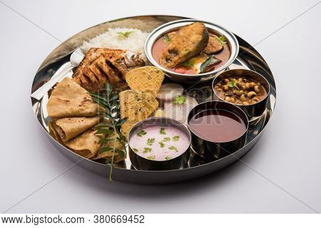 Indian Fish Platter Or Seafood Thali Served In A Steel Plate Or Over Banana Leaf