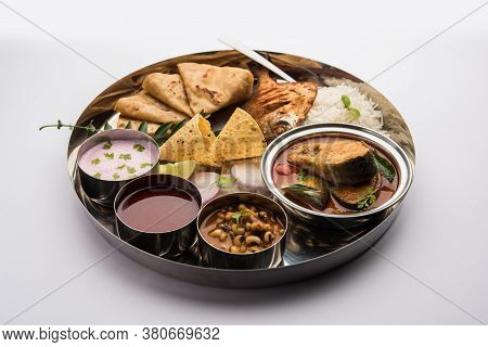 Indian Fish Platter Or Seafood Thali Served In A Steel Plate Or Over Banana Leaf
