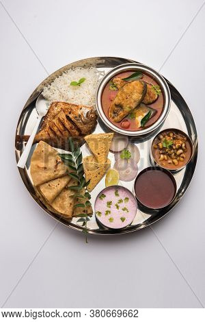Indian Fish Platter Or Seafood Thali Served In A Steel Plate Or Over Banana Leaf