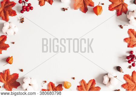 Autumn Composition. Frame Made Of Flowers, Maple Leaves On Gray Background. Autumn, Fall, Thanksgivi