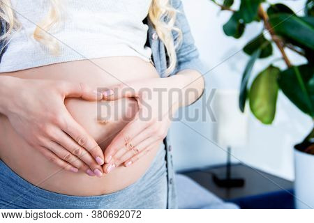 Close Up Of Pregnant Beautiful Woman Waiting For A Child Holding Cute Hand Heart Close To Beautiful 