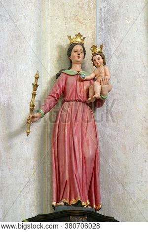 ROZGA, CROATIA - SEPTEMBER 15, 2012: Virgin Mary Queen statue on the main altar in the Church of St. Anne in Rozga, Croatia