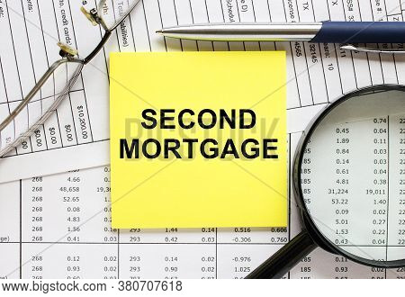 Text Second Mortgage On Financial Tables With Pen, Glasses