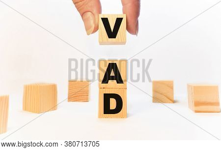 The Word Vad Which Is Made From Wooden Cubes. Isolated On White Background.