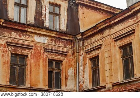 Old Vintage Dacayed Neglected Building Facade Closeup In Cloudy Day