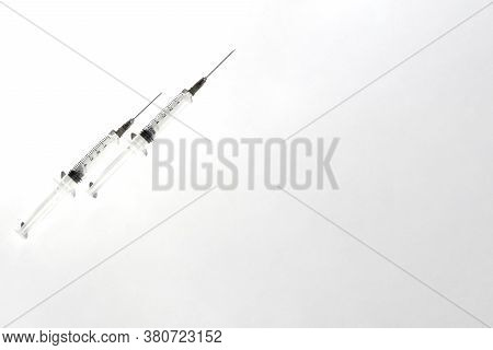 Medical Syringe. Clouse Up Of Syringe On White Background.