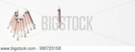 Medical Syringe From Diabetic Therapy. Clouse Up Of Syringe On White And Blue Background