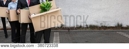 Unemployed People Move. Job Layoff. Employees Outside Office