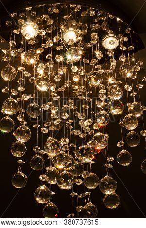 Beautiful Crystals Of Contemporary Chandelier Lighting. Vertical Image