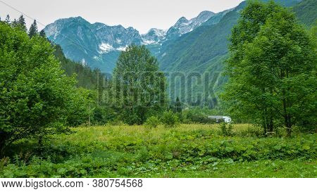 The Mountains Of The Julian Alps And Green Trenta Valley In Slovenia