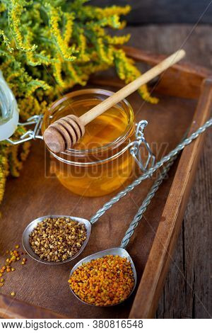 Bee Pollen Granules. Fresh Oney On Wooden Table. Still Life Bee Product Background. Wooden Spoon Wit