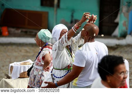 Salvador, Bahia / Brazil - January 25, 2015: Candomble Fans Are Seen During A Bath With Popcorn In T