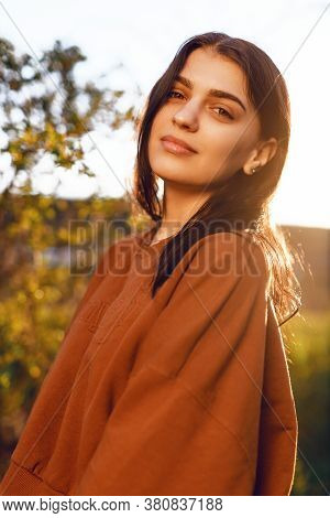 Portrait Of Beautiful Young Woman In The Sun Flare