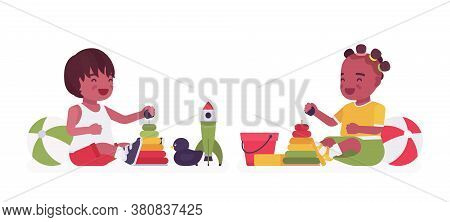 Toddler Children, Black Little Boy And Girl Enjoying Play With Sand Toys. Cute Happy Baby Aged 12 To