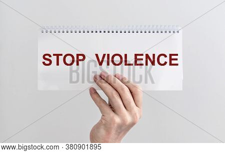 Stop Violence Sign Inscription Text On On Spiral Planner In Hand