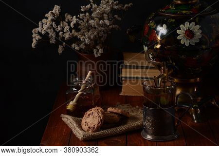 Tea Party In Rustic Style With Samovar
A Glass In Glass Holder, Honey And Cookies