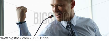 Portrait Of Confident Man In Presentable Suit Public Speaking With Strong Speech. Businessman Showin